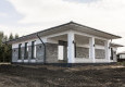 Дом с облицовкой кирпичом вибропрессованным (цвет Шунгит, мрамор белый и черный)