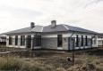 Дом с облицовкой кирпичом вибропрессованным (цвет Шунгит, мрамор белый и черный)